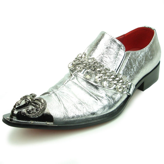 Introducing the FI-7460 Silver Leather Metal Tip by Fiesso, a chic shoe that combines silver leather with black accents for a fashion-forward look. It features stylish chain and metal embellishments on the toe, offering a touch of sophistication. The cushioned insole ensures comfort for all-day wear.