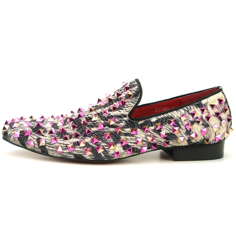 The FI-7496 Multi color Spike Slip on by Fiesso exudes edgy elegance with its black and white pattern, adorned with shiny pink and silver pyramid-shaped studs, reminiscent of leather spikes.