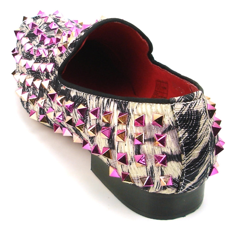 The FI-7496 Multi color Spike Slip on by Fiesso exudes edgy elegance with its black and white pattern, adorned with shiny pink and silver pyramid-shaped studs, reminiscent of leather spikes.