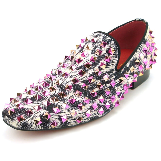 The FI-7496 Multi color Spike Slip on by Fiesso exudes edgy elegance with its black and white pattern, adorned with shiny pink and silver pyramid-shaped studs, reminiscent of leather spikes.