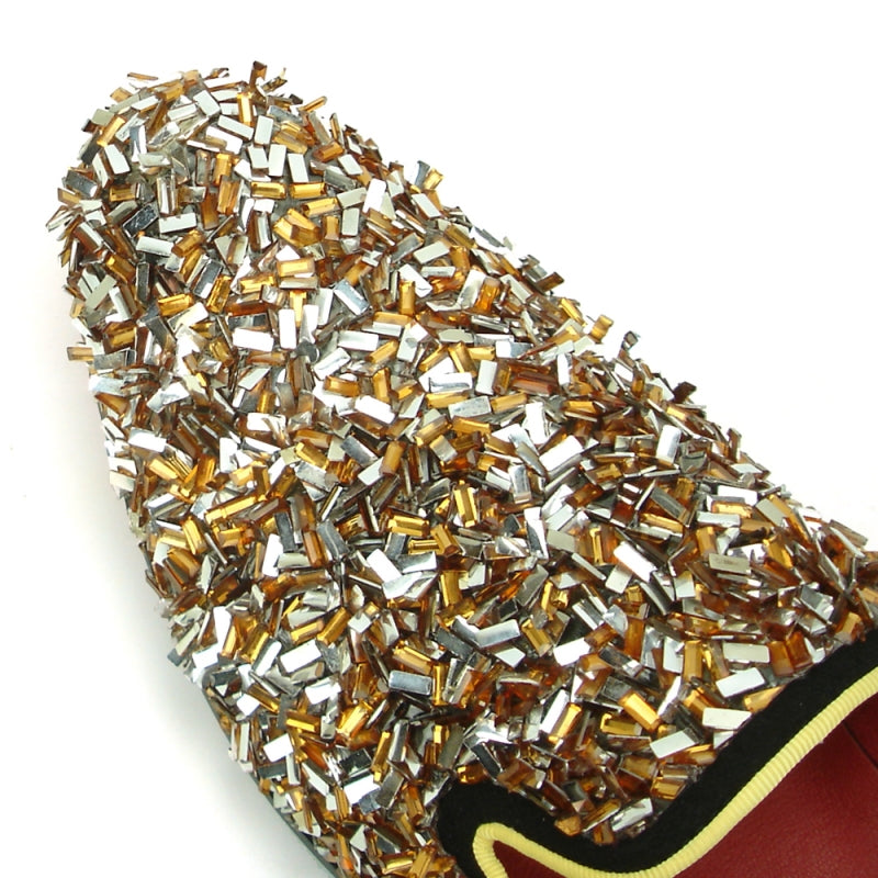 The FI-7498 Gold Slip on by Fiesso features a multicolored metallic embellishment and a black heel, enhanced by red interior lining and a sophisticated suede upper.