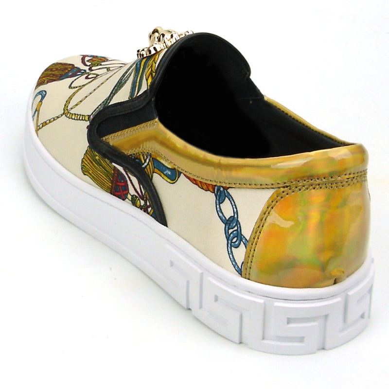 The FI-2383 Low Cut Sneaker Encore by Fiesso features a slip-on design made from micro leather, highlighted with a colorful pattern and topped with a gold lion detail, all set on a white sole.