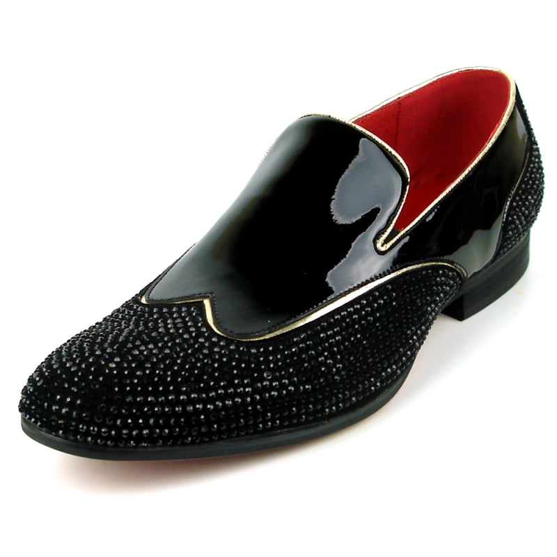 The FI-7483 Black Patent Wing Tip by Fiesso is a black fashion shoe with a patent leather upper and a red interior, featuring a glossy finish. It is elegantly adorned with small black beads and designed for comfort with its slip-on style and cushioned insole.