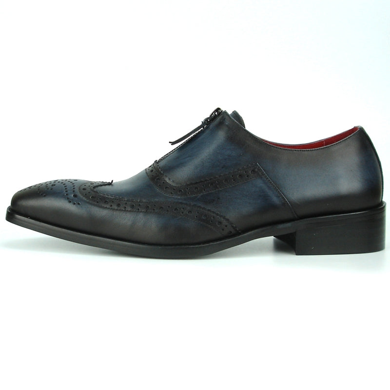 The FI-8714 Black Encore by Fiesso Slip-on Shoe showcases a stylish black and blue leather brogue design with a zipper, adorned with intricate perforated details. It features a vibrant red interior lining and offers enhanced comfort with a cushioned insole.