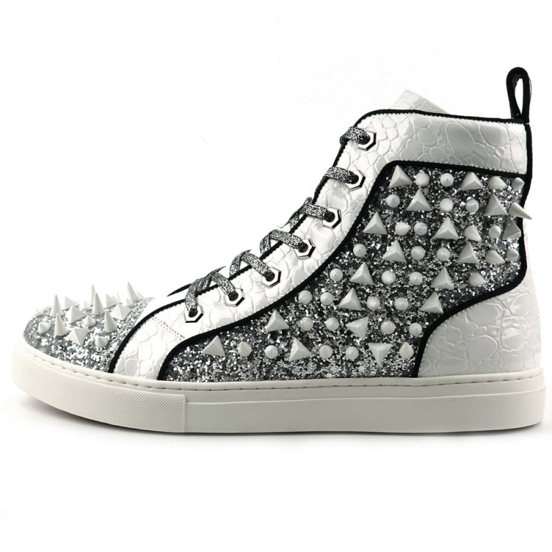 The FI-2369 White Spikes High Top Sneakers by Fiesso showcase a glittery upper embellished with metallic silver panels, complete with white laces and adorned with white spikes across the surface.