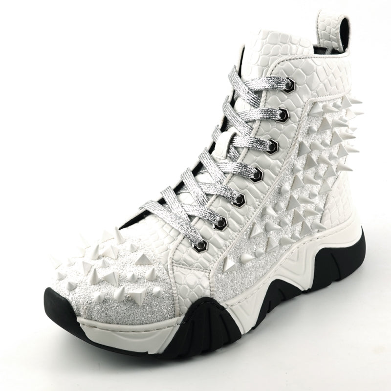 Introducing the FI-2405 White Spikes High Top Sneakers Encore by Fiesso, a striking fashion-forward design from Fiesso. These sneakers boast a textured white exterior accented with shimmering silver laces and adorned with numerous glittering spikes across the sides and front. The look is completed with a bold chunky black-and-white sole that instantly catches the eye.