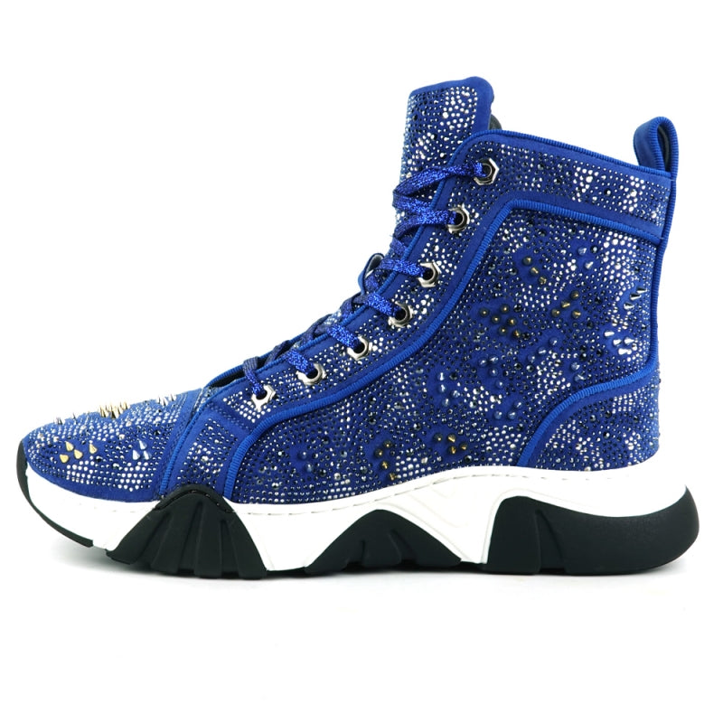 Introducing the FI-2412 Blue Suede Rhinestones Spikes Encore by Fiesso: a stylish blue high-top sneaker with a suede upper embellished with rhinestones and metallic spikes, set on a chunky white and black sole.