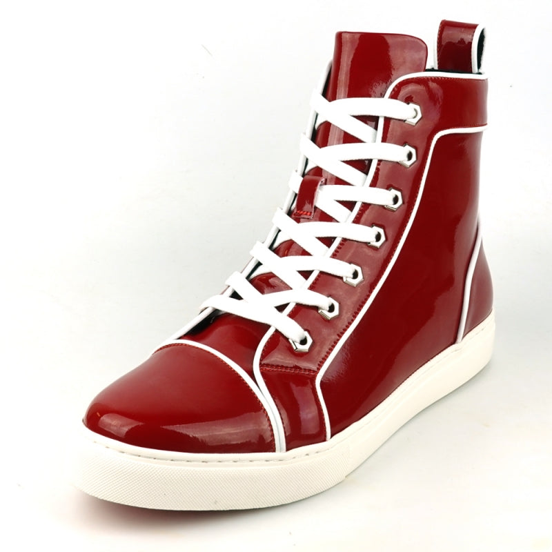 The FI-2416 Red Patent Leather High Top Sneaker by Fiesso is a striking piece with a glossy finish, adorned with white laces and trim, and featuring a white sole. It stands out against a plain background for an elegant and stylish look.