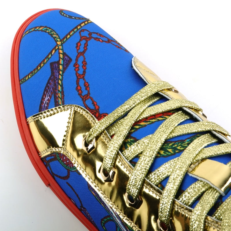 The FI-2421 Blue High Top Sneaker Encore by Fiesso features a striking blue and gold pattern, a distinctive red sole, multicolored laces, and is adorned with a Gold Lion emblem on the side.