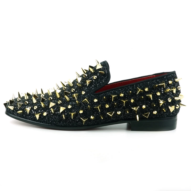 This slip-on suede shoe, the "FI-7517 Black Glitter Gold Spikes Fiesso by Aurelio Garcia" from Fiesso, features a sleek black exterior adorned with striking gold spikes and boasts a luxurious red interior lining.