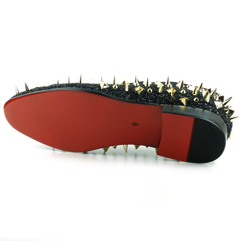 This slip-on suede shoe, the "FI-7517 Black Glitter Gold Spikes Fiesso by Aurelio Garcia" from Fiesso, features a sleek black exterior adorned with striking gold spikes and boasts a luxurious red interior lining.