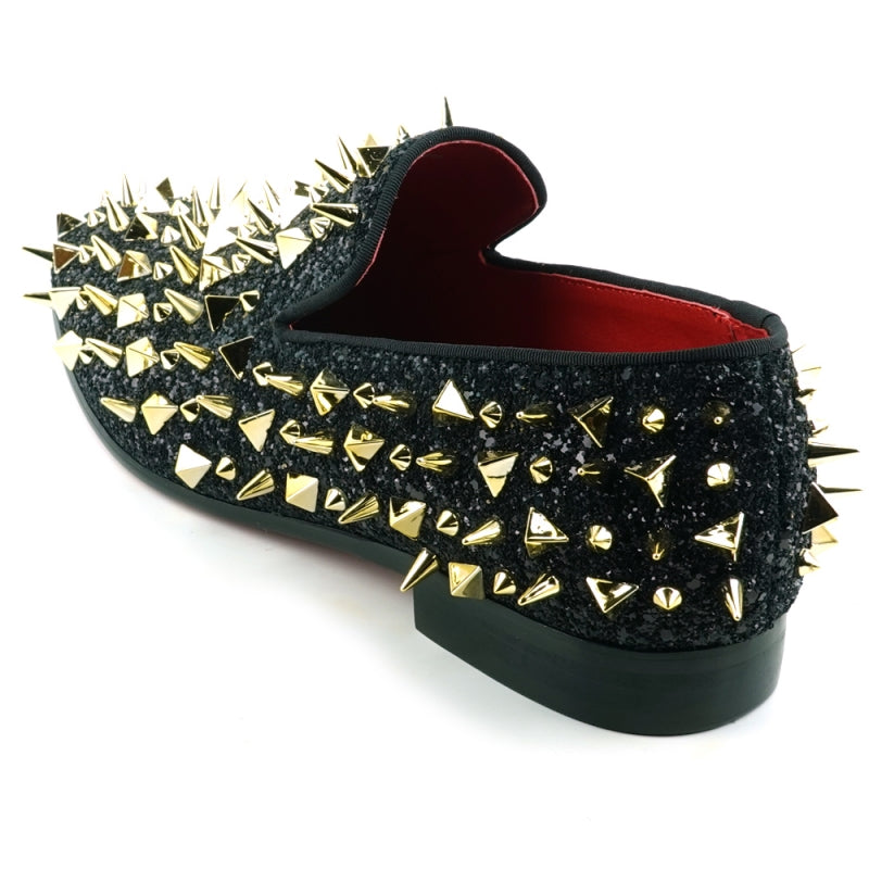 This slip-on suede shoe, the "FI-7517 Black Glitter Gold Spikes Fiesso by Aurelio Garcia" from Fiesso, features a sleek black exterior adorned with striking gold spikes and boasts a luxurious red interior lining.