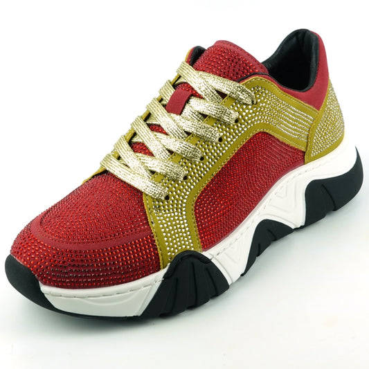 Introducing the FI-2407 Red Gold Encore by Fiesso, a men's casual sneaker in striking red and gold. This standout shoe features glittery embellishments, gold laces, and a chunky black and white sole. Suede accents bring added texture while subtle rhinestones enhance its sparkle for an extra eye-catching finish.