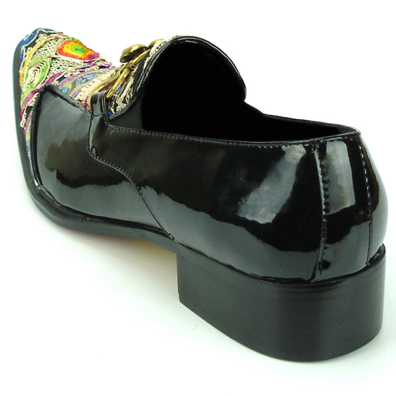 The FI-7237 Black-Multicolor Slip On by Fiesso offers a stylish design with a leather upper and low heel, featuring intricate patterns and decorative gold flowers. It provides ultimate comfort with its cushioned insole.