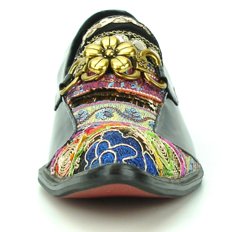 The FI-7237 Black-Multicolor Slip On by Fiesso offers a stylish design with a leather upper and low heel, featuring intricate patterns and decorative gold flowers. It provides ultimate comfort with its cushioned insole.