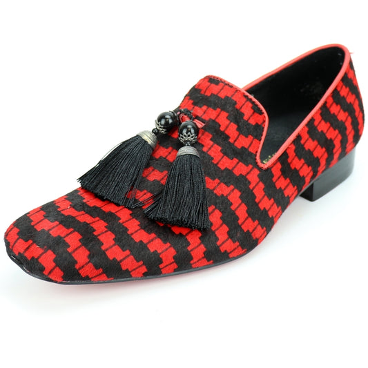 The FI-7254 by Fiesso, also known as the Black Red Pony Hair Slip On With Tassel from Aurelio Garcia, is a fashion shoe featuring a red and black pattern. It boasts a slip-on design with black tassels and includes a low heel along with a cushioned insole for enhanced comfort.