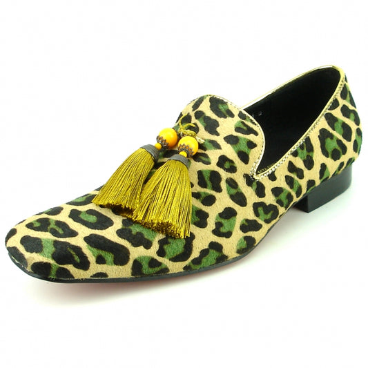 The FI-7254 Leopard Pony Hair Slip On With Tassel by Fiesso is a fashionable shoe featuring a leopard print loafer design with green and black spots, enhanced by a pony hair upper and vibrant yellow tassels on the front.