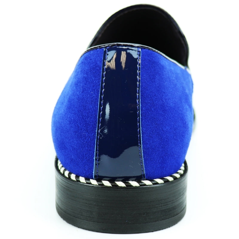 The Fiesso FI-7280 Blue Suede Cap Toe Slip On by Aurelio Garcia is a stylish shoe featuring a glossy patent leather toe cap and a sleek black sole.