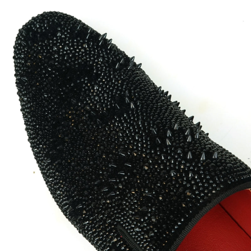 Explore the FI-7516 Black Suede Rhinestones Spikes Slip-on Loafer by Fiesso, embellished with gleaming studs and rhinestone spikes, and showcasing a striking red interior lining.