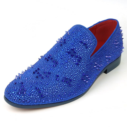 The FI-7516 Blue Suede Rhinestones Spikes Slip On Loafer from Fiesso by Aurelio Garcia effortlessly blends elegance with an edgy touch. Featuring blue rhinestone spikes and a bold red interior lining, this standout shoe is an ideal addition to any men's dress wardrobe, offering a unique flair that perfectly complements your style.