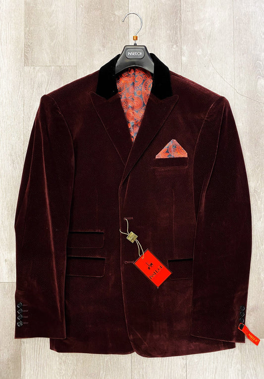 A deep burgundy velvet blazer with contrasting black lapels, featuring a paisley-patterned lining and a coordinating pocket square. The Inserch Two Button Velvet Dot Print Blazer BL004-31 is showcased on a hanger with its price tags attached.