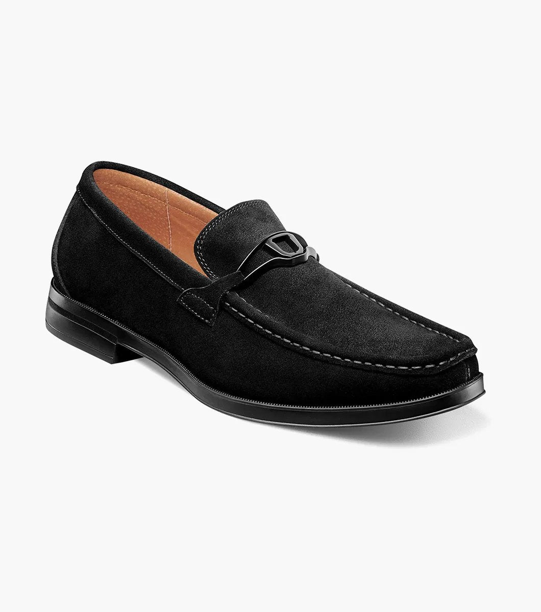 Stacy Adams PALLADIAN Moc Toe Slip On in black suede, featuring a metal buckle detail and stitching accents, complete with a comfortable Memory Foam insole, displayed on a white background.