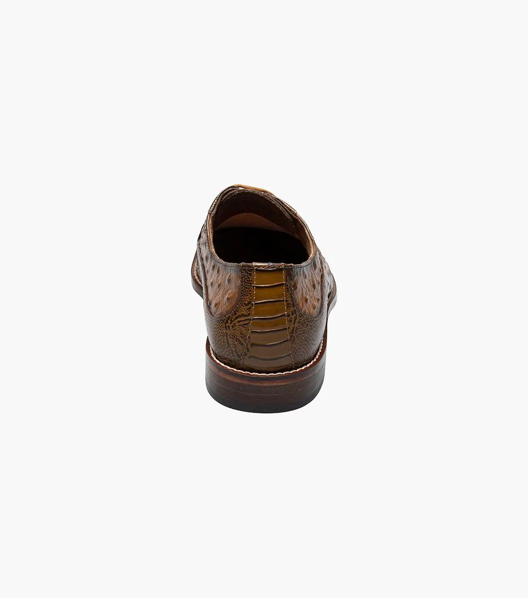 The Stacy Adams - FANELLI Modified Wingtip Oxford in Tan (25536-240) is a classic dress shoe featuring a textured design with laces, a low heel, polished finish, and outstanding arch support.