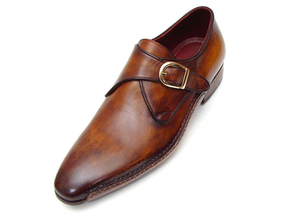 The Paul Parkman Single Monkstraps Brown Leather - 69V5E shoes feature a distinctive buckle, visible stitching, and a low heel. These men's handmade shoes by Paul Parkman highlight exquisite craftsmanship with their hand-painted leather finish.