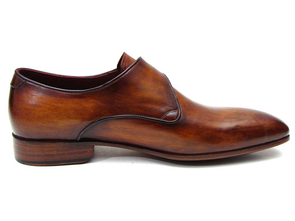 The Paul Parkman Single Monkstraps Brown Leather - 69V5E shoes feature a distinctive buckle, visible stitching, and a low heel. These men's handmade shoes by Paul Parkman highlight exquisite craftsmanship with their hand-painted leather finish.