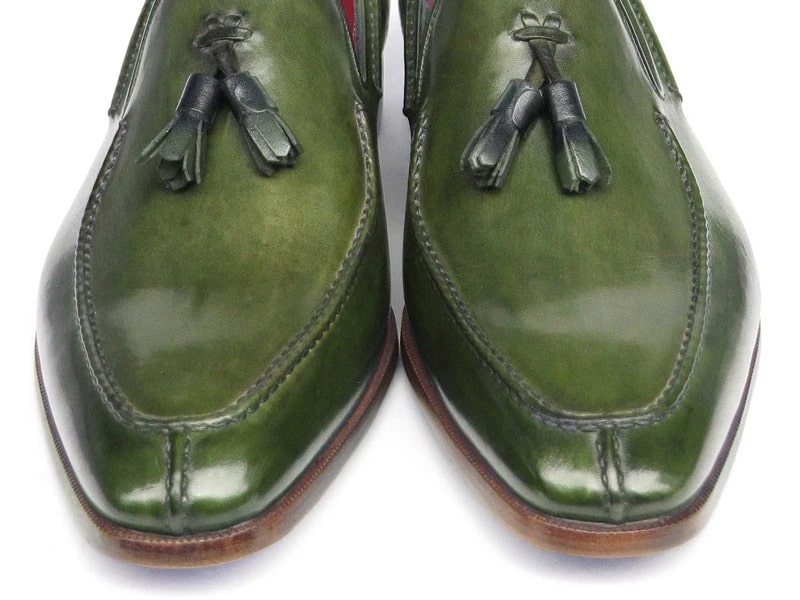 These striking Paul Parkman Tassel Loafers, labeled 083-GREEN, are crafted from hand-painted green leather and feature luxurious red interiors and elegant wooden heels.