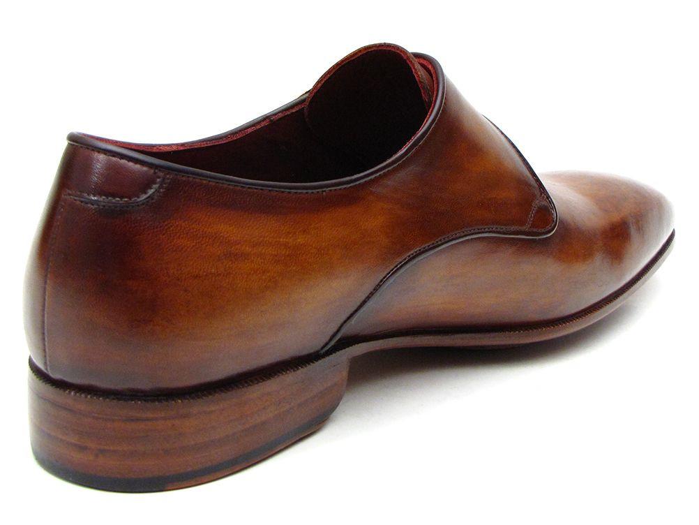 The Paul Parkman Single Monkstraps Brown Leather - 69V5E shoes feature a distinctive buckle, visible stitching, and a low heel. These men's handmade shoes by Paul Parkman highlight exquisite craftsmanship with their hand-painted leather finish.