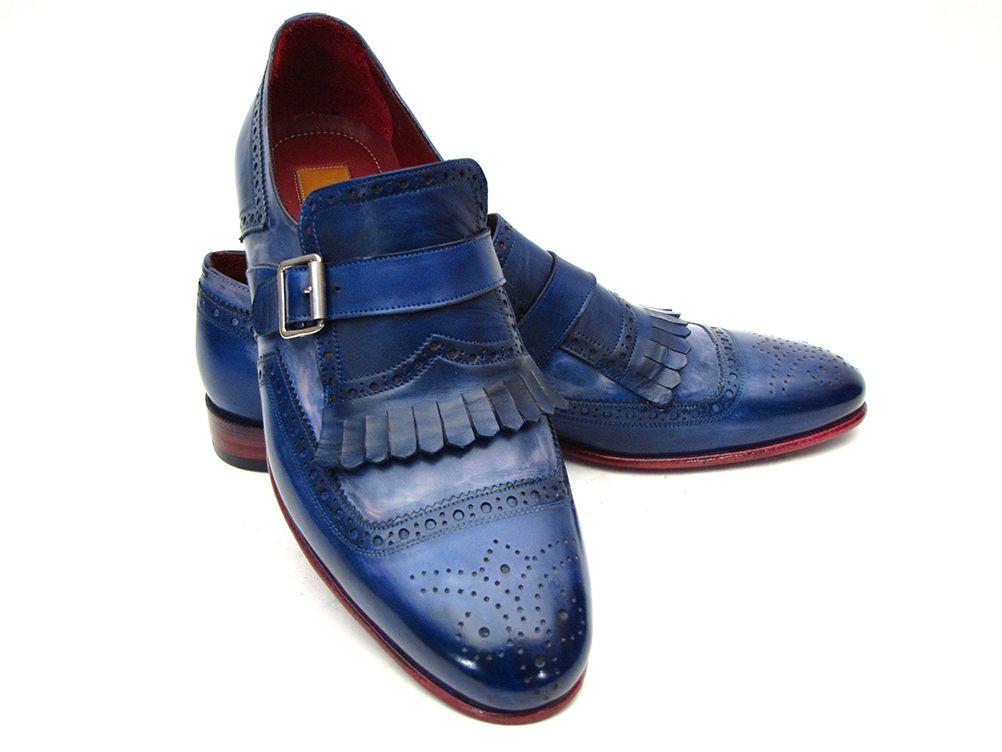 Introducing the Paul Parkman Kiltie Monkstrap Shoes, model 12BL78. This exquisite pair showcases handpainted dual-tone blue calfskin leather adorned with brogue detailing, buckles, and fringe accents. Crafted to order for those who appreciate timeless elegance and craftsmanship, these shoes embody the renowned quality of Paul Parkman.