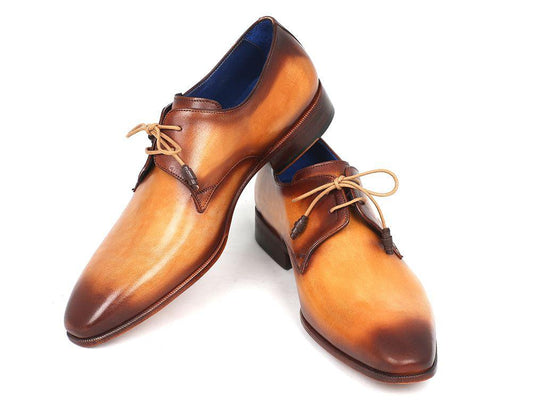 Introducing the Paul Parkman Brown & Camel Hand-Painted Derby Shoes - 326-CMLBRW, a testament to classic craftsmanship. These Derby-style dress shoes feature a combination of tan and brown hand-painted leather with beige laces, complemented by a polished finish and wooden sole.