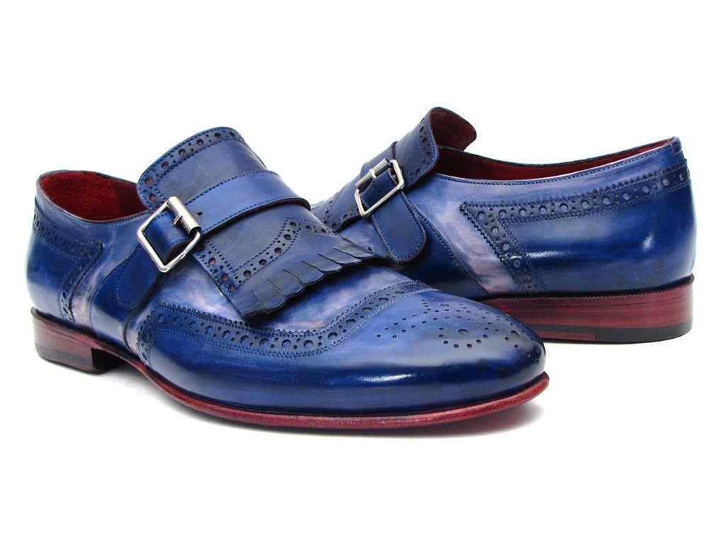 Introducing the Paul Parkman Kiltie Monkstrap Shoes, model 12BL78. This exquisite pair showcases handpainted dual-tone blue calfskin leather adorned with brogue detailing, buckles, and fringe accents. Crafted to order for those who appreciate timeless elegance and craftsmanship, these shoes embody the renowned quality of Paul Parkman.