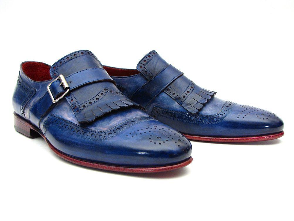 Introducing the Paul Parkman Kiltie Monkstrap Shoes, model 12BL78. This exquisite pair showcases handpainted dual-tone blue calfskin leather adorned with brogue detailing, buckles, and fringe accents. Crafted to order for those who appreciate timeless elegance and craftsmanship, these shoes embody the renowned quality of Paul Parkman.