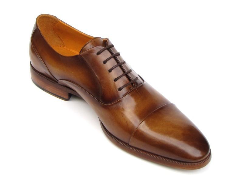 Introducing the Paul Parkman Captoe Oxfords in Brown Leather, model 074-CML—a pair of exquisitely handmade men's dress shoes in a classic oxford captoe style, displayed from both top and side angles. Crafted by renowned brand Paul Parkman, these shoes boast elegant brown leather finishes and tasteful laces.