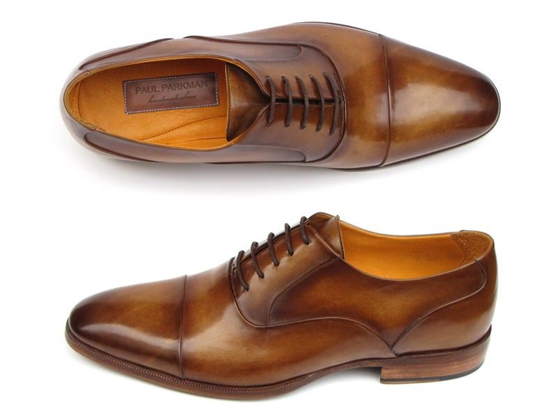 Introducing the Paul Parkman Captoe Oxfords in Brown Leather, model 074-CML—a pair of exquisitely handmade men's dress shoes in a classic oxford captoe style, displayed from both top and side angles. Crafted by renowned brand Paul Parkman, these shoes boast elegant brown leather finishes and tasteful laces.