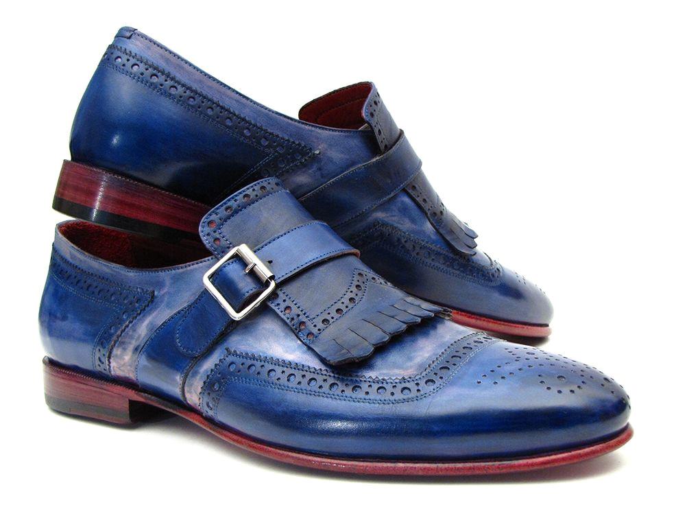 Introducing the Paul Parkman Kiltie Monkstrap Shoes, model 12BL78. This exquisite pair showcases handpainted dual-tone blue calfskin leather adorned with brogue detailing, buckles, and fringe accents. Crafted to order for those who appreciate timeless elegance and craftsmanship, these shoes embody the renowned quality of Paul Parkman.