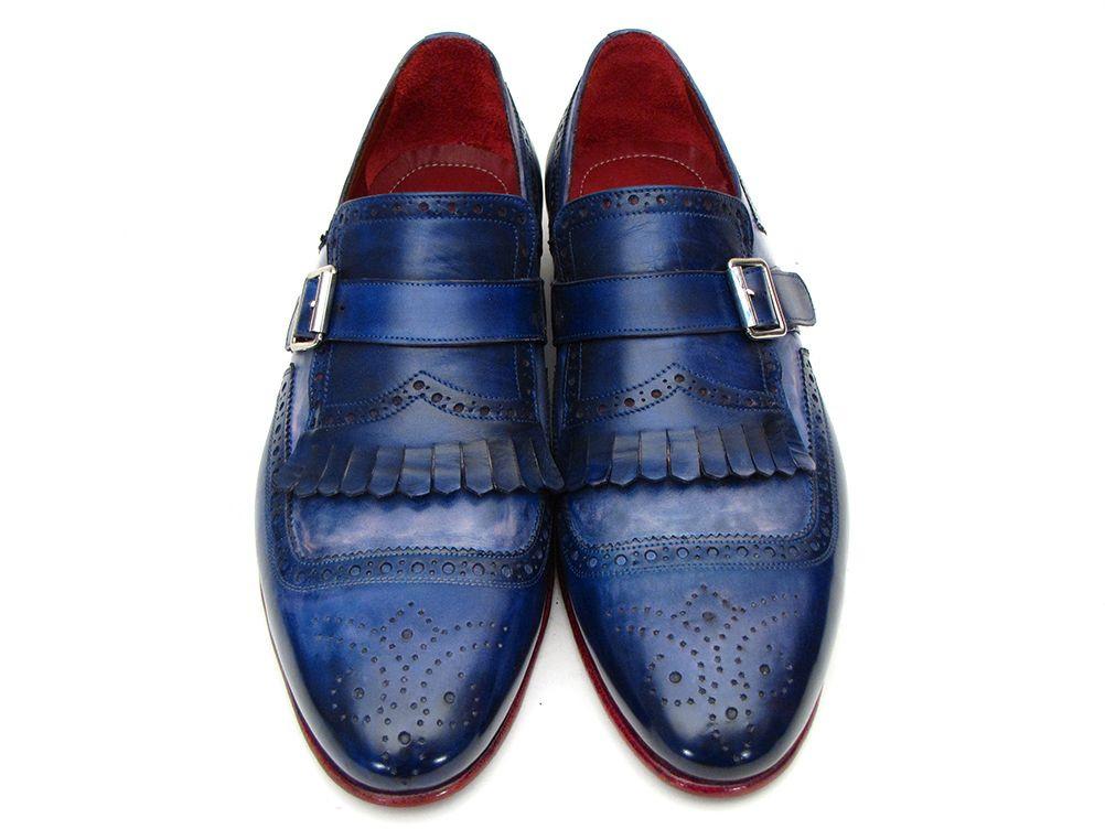 Introducing the Paul Parkman Kiltie Monkstrap Shoes, model 12BL78. This exquisite pair showcases handpainted dual-tone blue calfskin leather adorned with brogue detailing, buckles, and fringe accents. Crafted to order for those who appreciate timeless elegance and craftsmanship, these shoes embody the renowned quality of Paul Parkman.