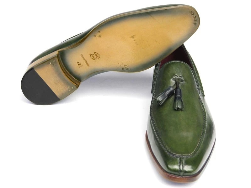 These striking Paul Parkman Tassel Loafers, labeled 083-GREEN, are crafted from hand-painted green leather and feature luxurious red interiors and elegant wooden heels.