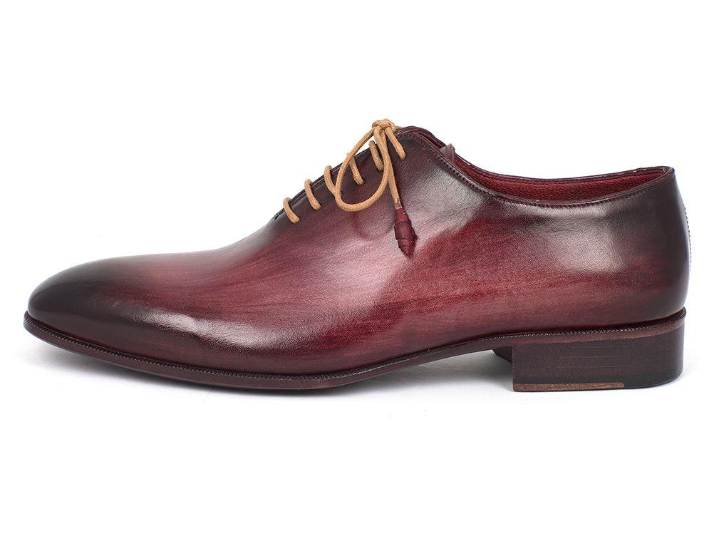 Paul Parkman Burgundy Wholecut Plain Toe Oxfords - DS65BUR from Paul Parkman are a pair of burgundy leather oxfords with tan laces, showcasing a sleek design, visible stitching, and a hand-painted calfskin finish for an added touch of elegance.