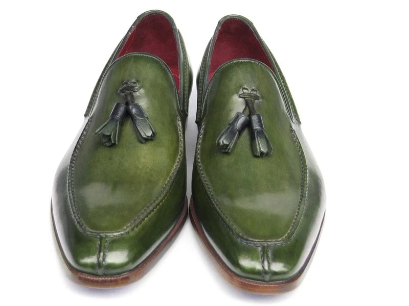 These striking Paul Parkman Tassel Loafers, labeled 083-GREEN, are crafted from hand-painted green leather and feature luxurious red interiors and elegant wooden heels.