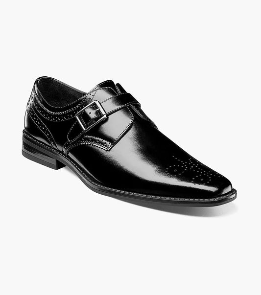 The Stacy Adams - KINSLEY Plain Toe Monk Strap in black showcases its smooth leather, a sophisticated monk strap with a sleek buckle, pointed toe, and low heel, all beautifully presented against a white background.