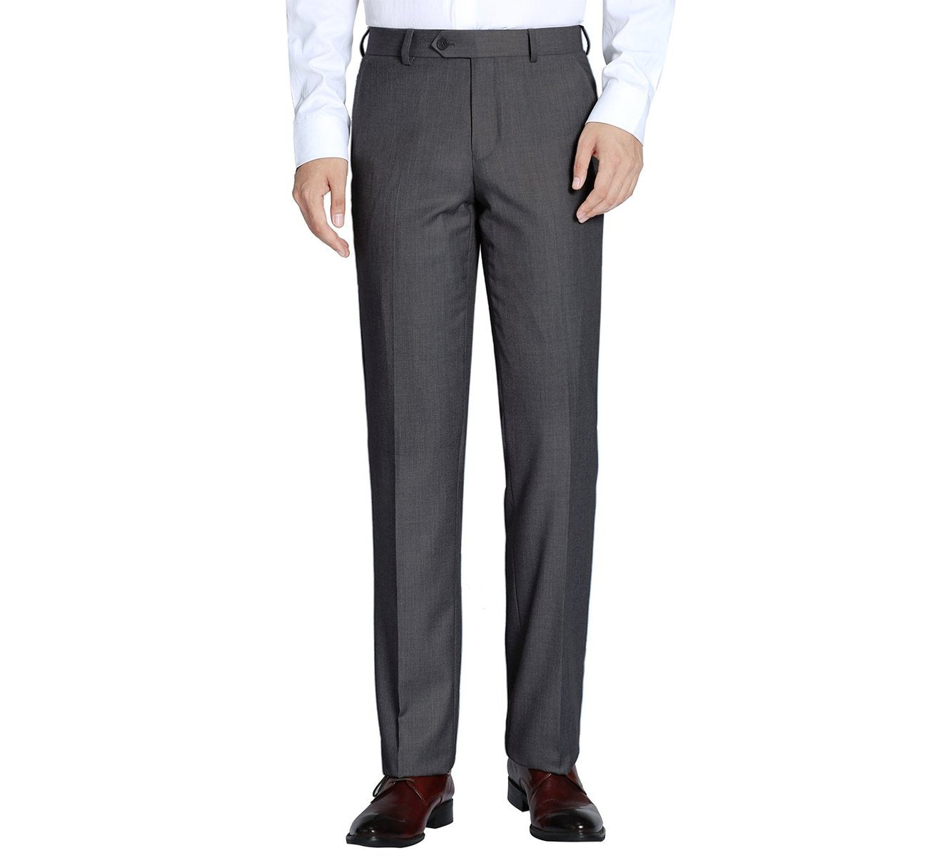 A person wearing Alessandro Vitello by Renoir charcoal classic fit flat front suit separate pants, a white shirt, and brown dress shoes stands against a plain white background.