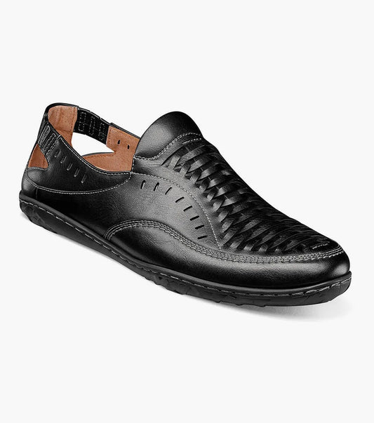 The Stacy Adams IBIZA Woven Vamp Moc Toe Slip On in black (model 25440-001) showcases a cushioned footbed for enhanced comfort. With its closed toe and open heel design, this slip-on sandal is completed with a lightweight EVA sole, making it ideal for everyday wear.