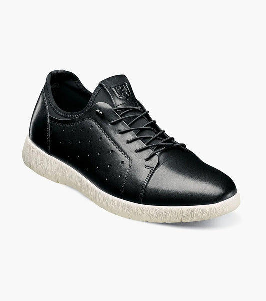 The Stacy Adams - HALDEN Lace Up Sneaker in black showcases a burnished leather upper and perforated side details, set against a plain white backdrop. It features a white rubber sole and cushioned footbed for optimal comfort.