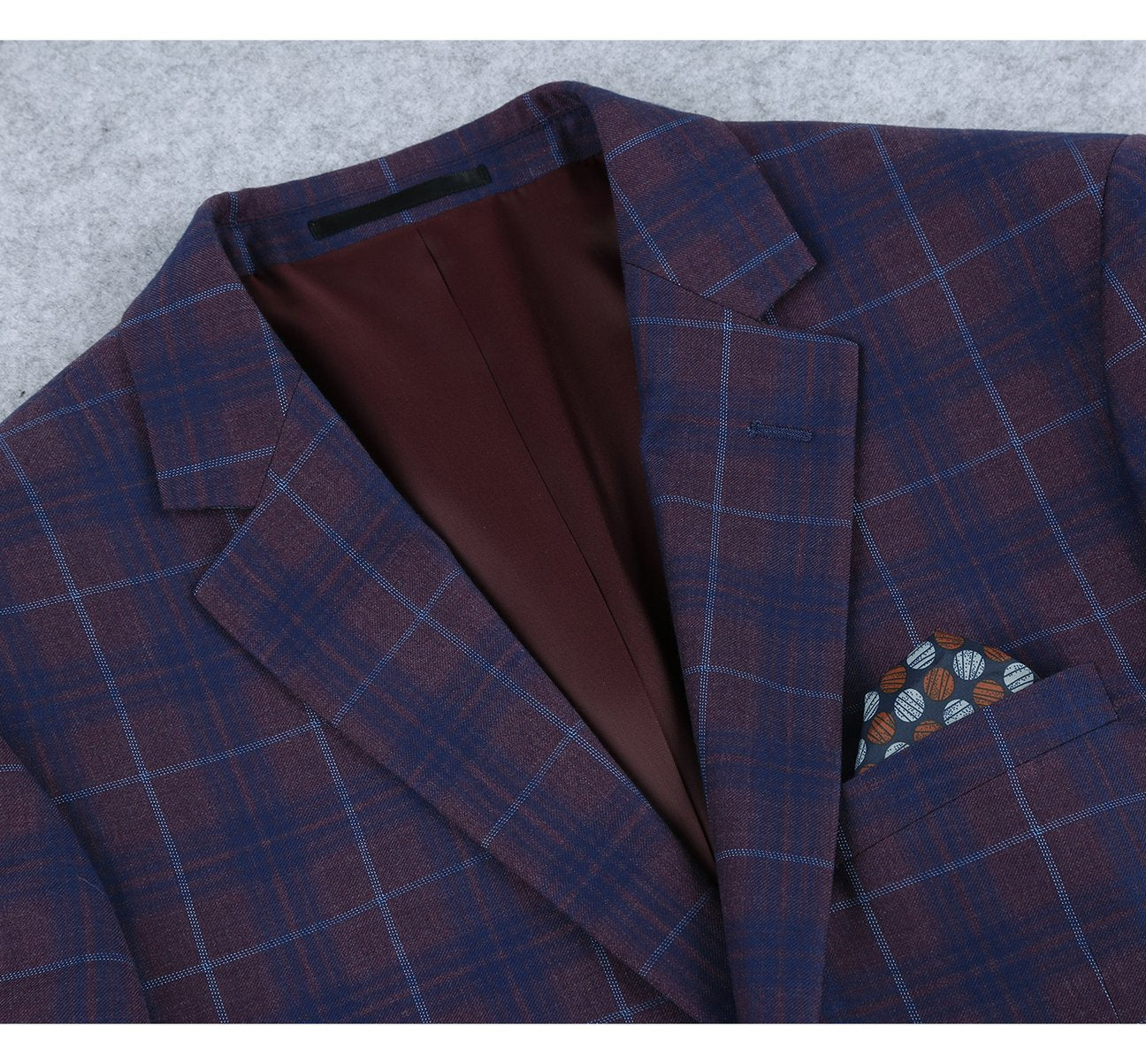 The Alessandro Vitello by Renoir Purple 2 Buttons Slim Fit Premium Plaid Sport Coat 294-3 is a sleek menswear piece that blends classic style with modern flair. It features a stylish blue and burgundy plaid check pattern, two-button closure, two front pockets, and an elegant pocket square.