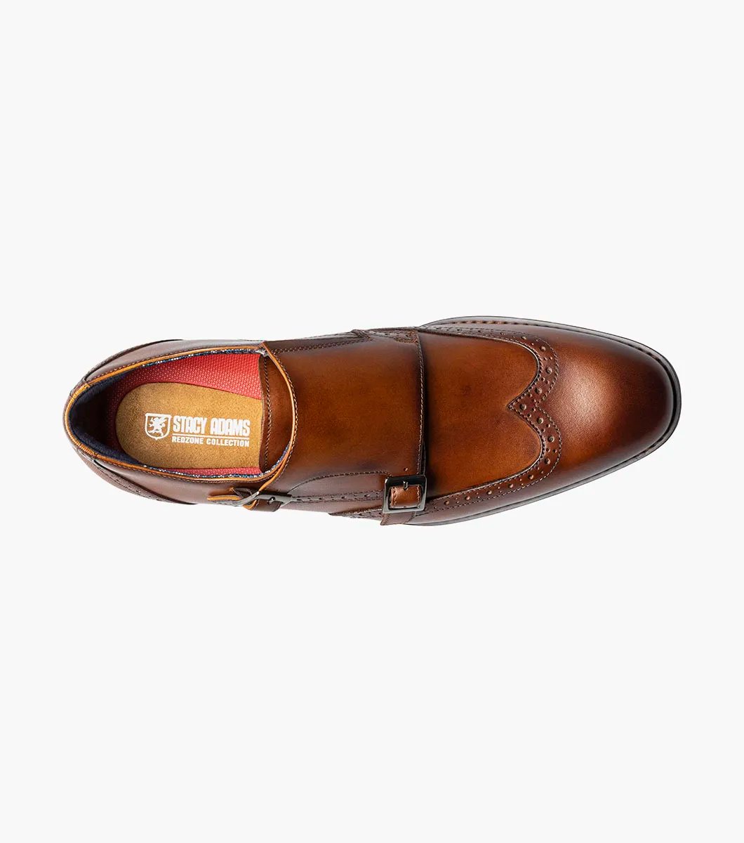 The Stacy Adams - KARSON Wingtip Double Monk Strap in cognac, model number 25570-221, is a shoe crafted with brown leather and features wingtip decorative perforations along with two side buckles, complemented by a RedZone footbed for exceptional comfort.