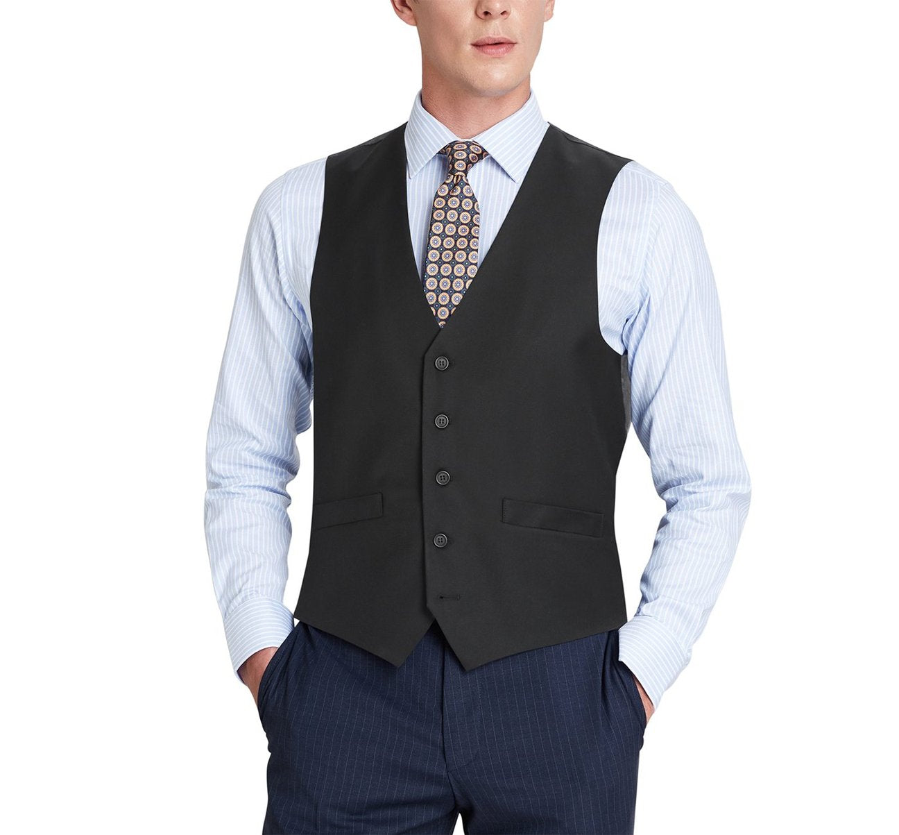 A man wearing the Alessandro Vitello by Renoir black business suit vest with regular fit, paired with a striped shirt, patterned tie, and dark trousers made of polyester viscose, with his hands in his pockets.