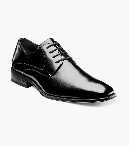 The Stacy Adams WAYDE PLAIN TOE OXFORD in polished black genuine leather showcases a cushioned footbed, lace-up design, and low heel against a plain white background.